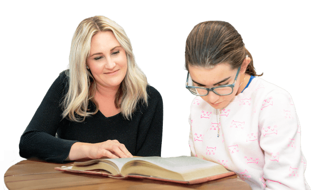 student sitting with a teacher