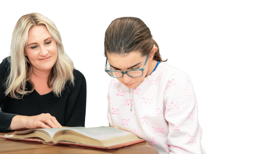 student sitting with a teacher